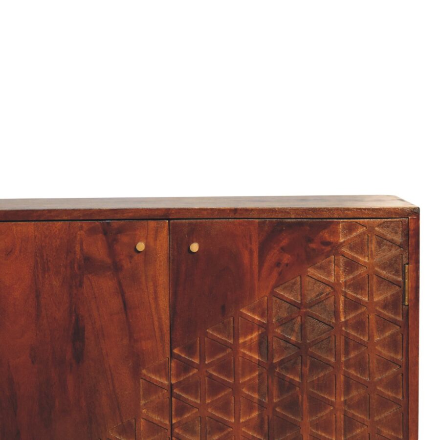 Wooden cabinet with geometric pattern design.