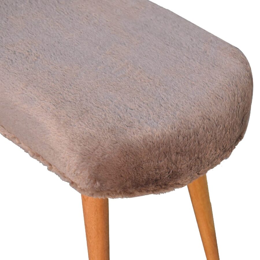 Furry brown stool with wooden legs