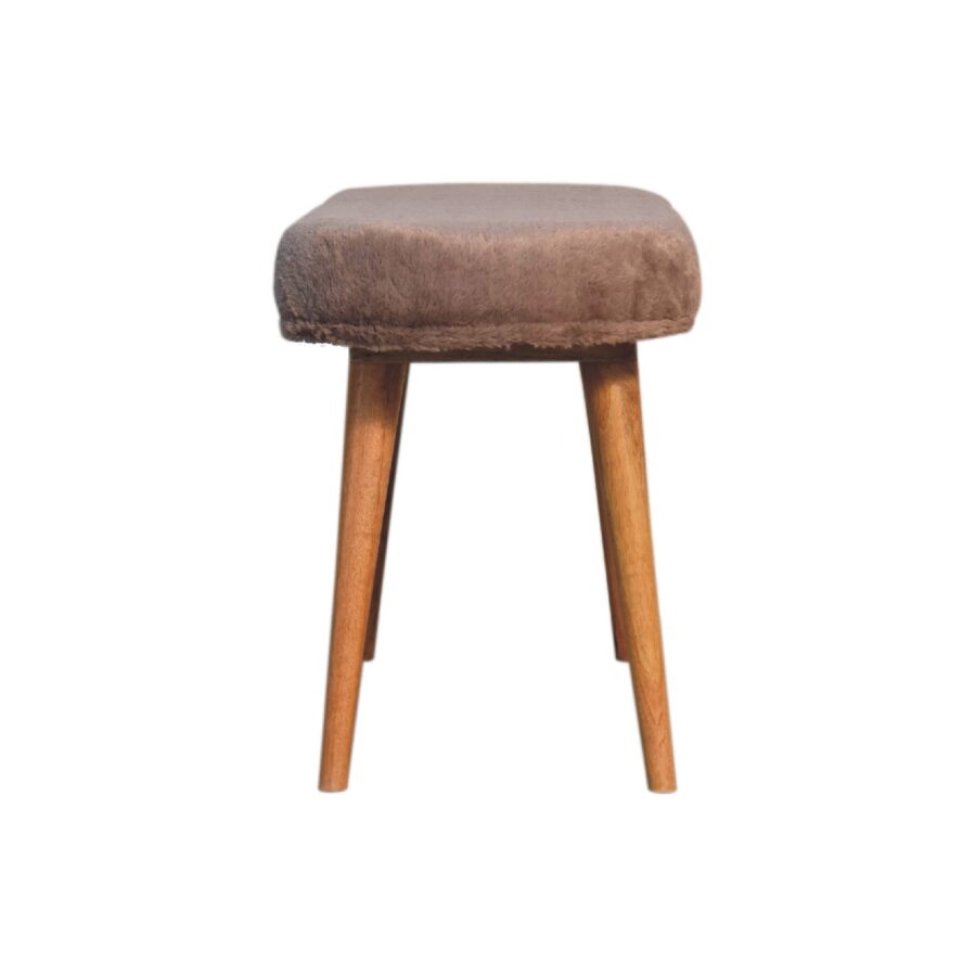 Wooden stool with brown cushion on white background.