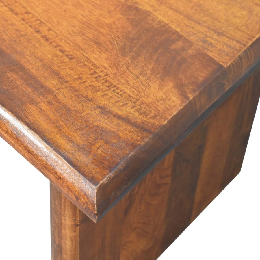 Close-up of polished wooden table corner.