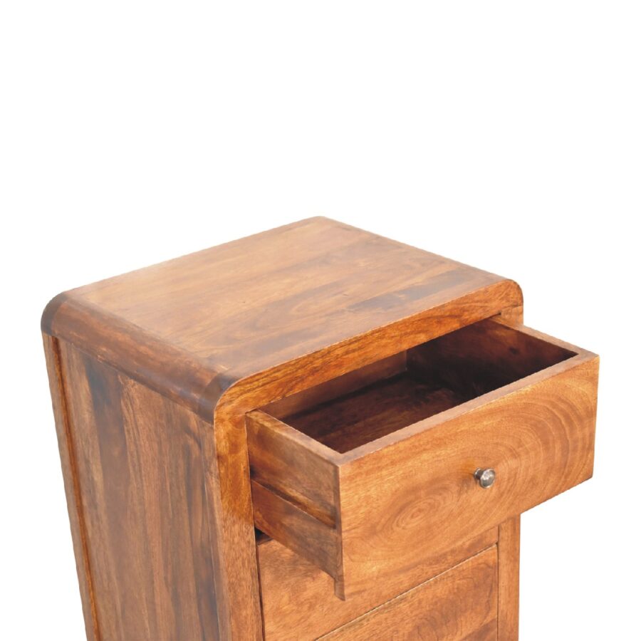 Wooden bedside table with open drawer.