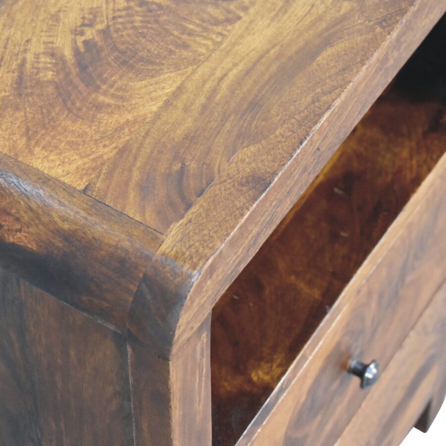 Close-up of open wooden drawer detail.